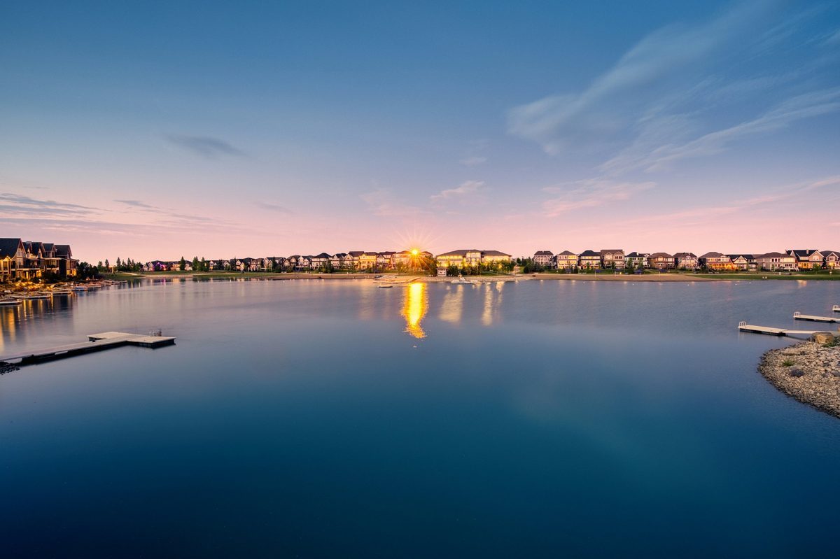 Mahogany lake at sunset with docks and lakeside homes